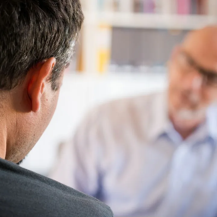A man talking with a counsellor